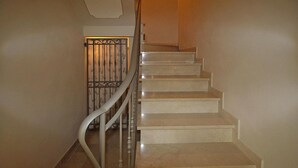 A staircase with a metal railing and a decorative gate at the top. - Villa in Camaiore Near Sandy Beaches (Camaiore)