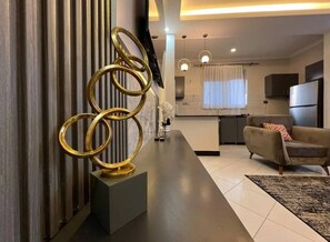Luxury Apartment, Balcony, City View | Living area | Flat-screen TV