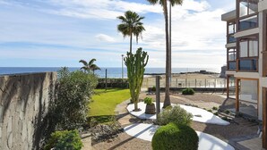 A modern building with large windows and a view of the sea. - Apartment, San Agustin (San Bartolomé de Tirajana)