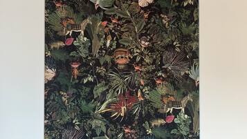 A wall with a detailed botanical mural.