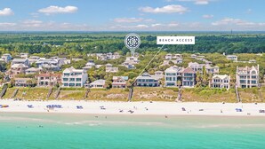 A coastal residential area with beachfront properties, a clear sky, and a view of the ocean. - Barefoot By The Sea|Easy Beach Access|Private Pool|Gulf Views from Lookout Tower (Santa Rosa Beach)