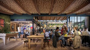 A spacious indoor area with wooden floors, tables, and chairs, featuring a high ceiling with string lights. - THE SPACE TO STAY APARTHOTEL (St. Andrews)