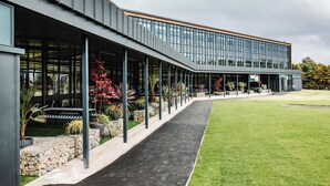 A modern building with a covered walkway, stone steps, and potted plants. - THE SPACE TO STAY APARTHOTEL (St. Andrews)