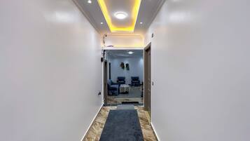 Basic Triple Room | Living area | 32-inch LCD TV with satellite channels