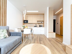 Apartment | Private kitchen | Electric kettle, toaster, highchair - Apartment With River View, Sauna, and Indoor Pool (Dziwnów)