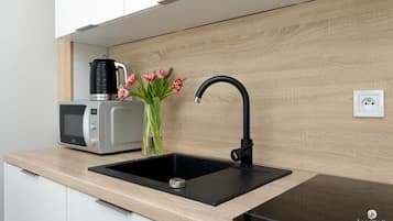 Apartment | Private kitchen | Electric kettle, highchair
