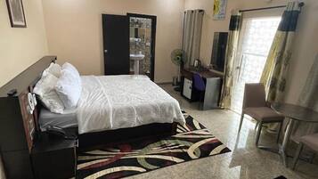 Economy Room, Balcony, City View | Desk, laptop workspace, free WiFi