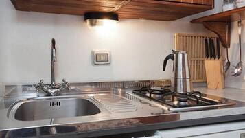 Fridge, coffee/tea maker, electric kettle, toaster