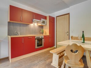 Apartment | Private kitchen | Electric kettle, toaster, high chair