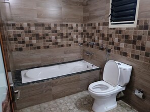 Executive Room, Multiple Beds | Bathroom | Shower, rainfall showerhead, hair dryer, soap - HotelGurubhavan (Devikolam)