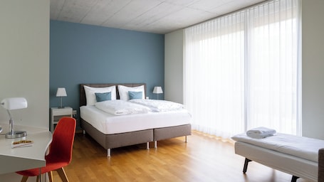 Superior Triple Room | Hypo-allergenic bedding, desk, laptop workspace, blackout curtains. Gästehaus Hunziker