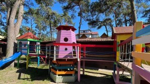 A playground with colorful play structures, including a slide and climbing areas. - New Houses Available Near the sea in Dziwnowek (Dziwnów)