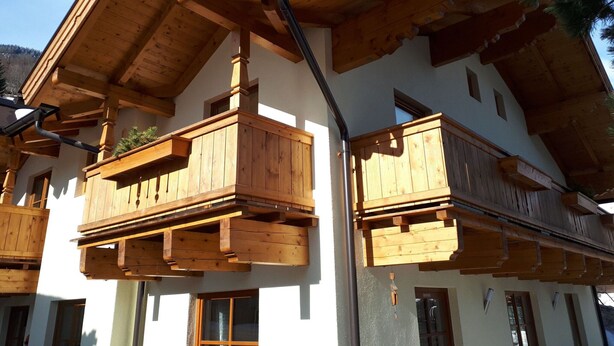 A multi-story building with wooden balconies and a sloped roof. - Apartment in Bramberg Near Ski Lift & Wildkogel (Bramberg am Wildkogel)