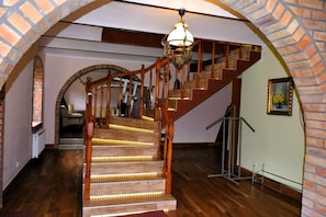 A wooden staircase with a handrail, leading to an upper floor. - Holiday Home in Natura 2000 With Fishing (Tuczno)