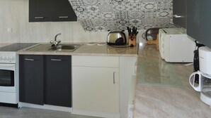 A compact kitchen with a sink, toaster, and coffee maker. - New Holiday Home in Nowe Warpno for 6 Persons (Nowe Warpno)