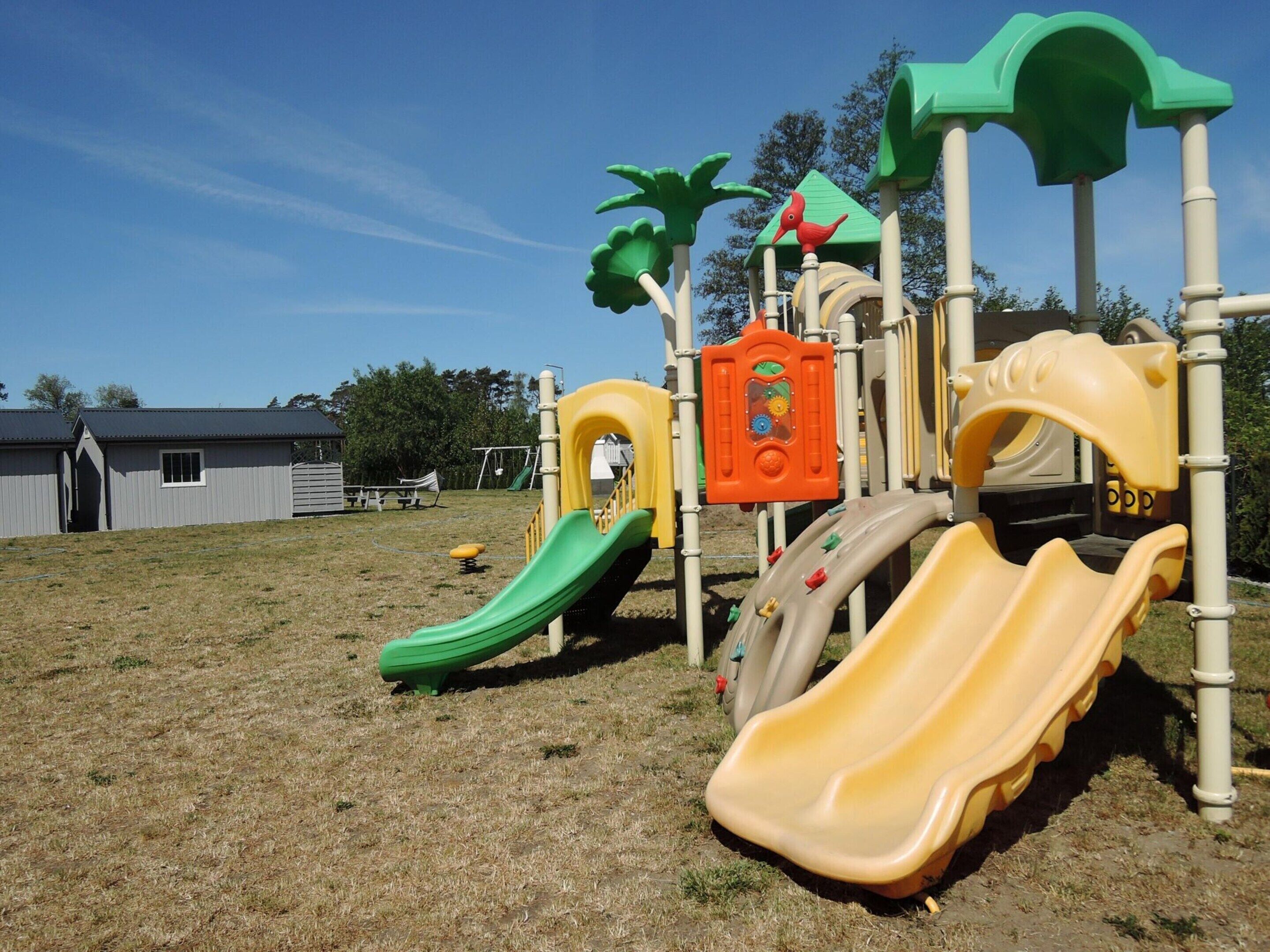 A playground with slides and climbing structures.