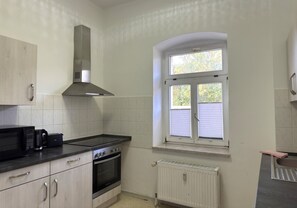 Apartment | Private kitchen | Electric kettle, toaster, high chair