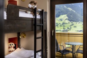 A bunk bed with a view of a mountainous landscape through a glass door. - Apartment in Matrei With View (Matrei in Osttirol)