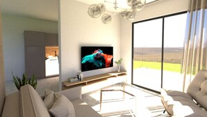 A modern living room with a large flat-screen TV, a sofa, and a dining area visible through a glass door. - Apartment in Privlaka Near Sandy Beach (Privlaka)