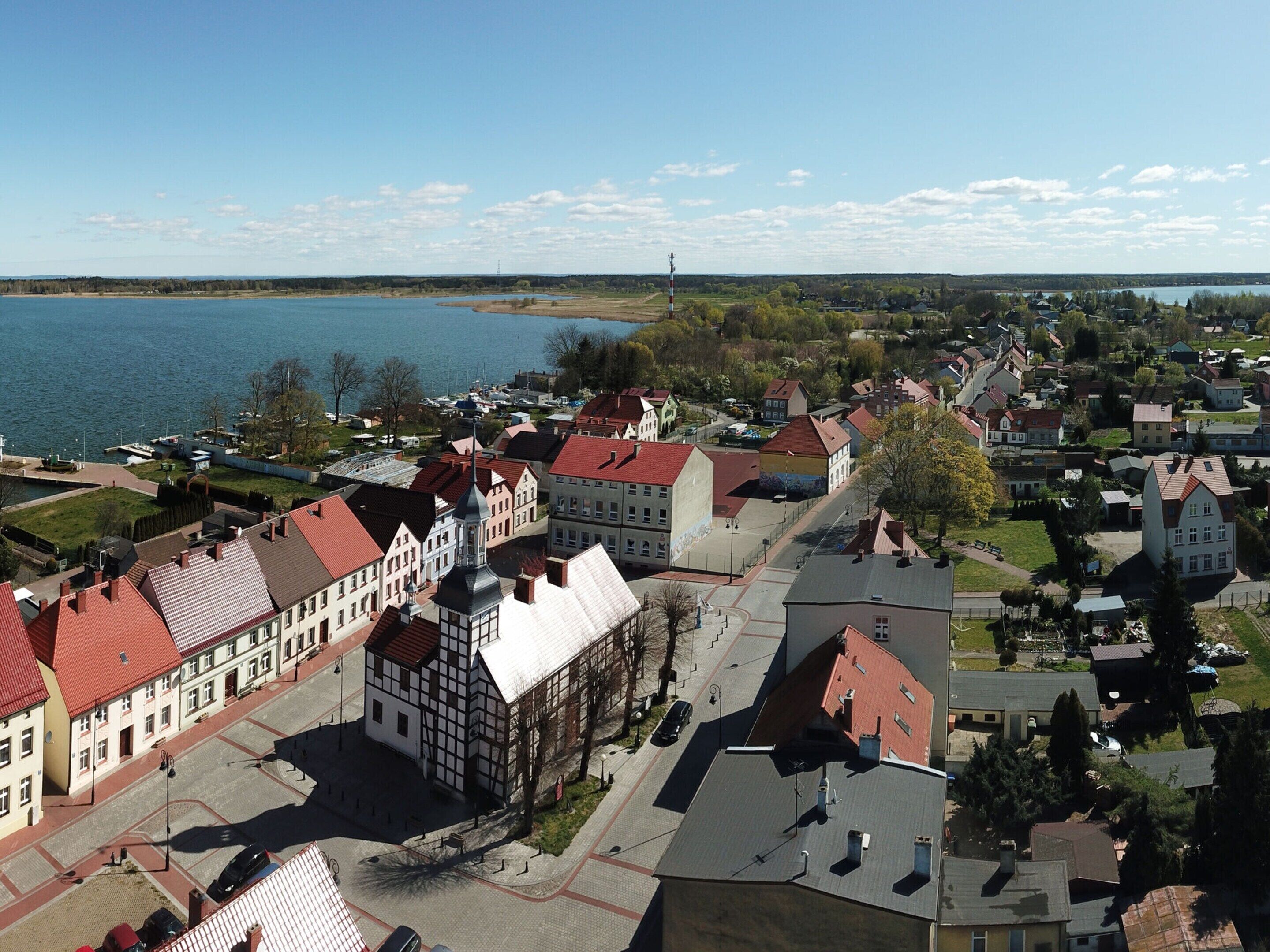 A town with historic buildings, a river, and a bridge.