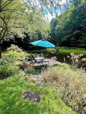 Terrace/patio. Enchanted Haven on a Private Pond in Stowe