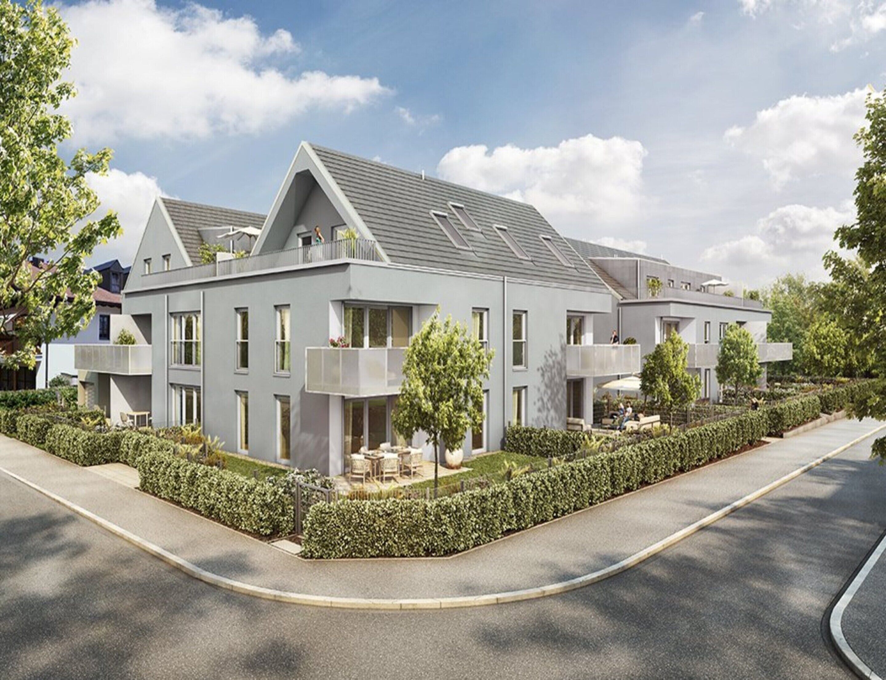 Un immeuble résidentiel moderne doté de nombreux balcons, d’un jardin aménagé et d’une allée incurvée.