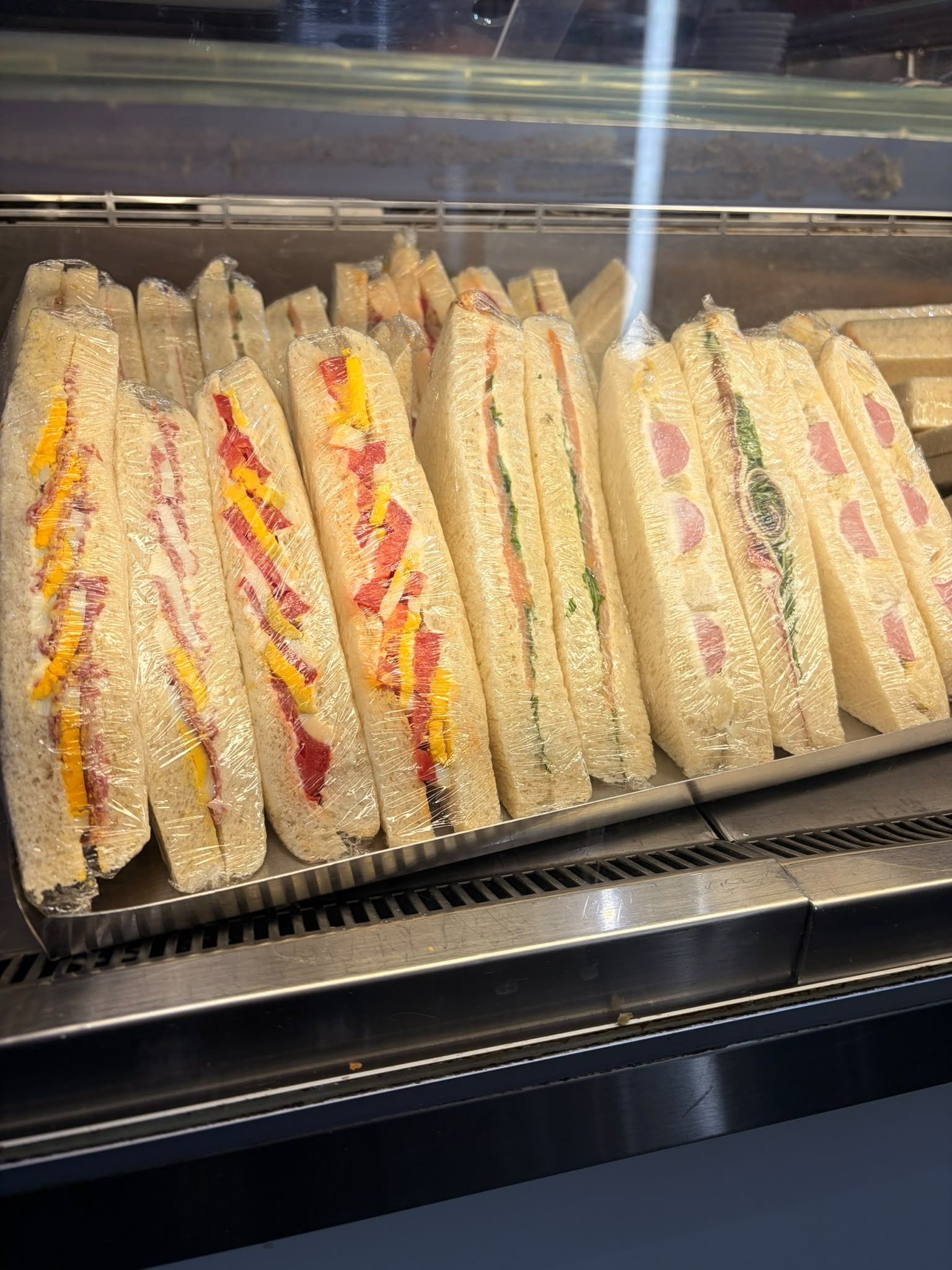 A display case with sandwiches.