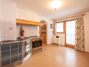 Apartment | Private kitchen | Stovetop, electric kettle, toaster