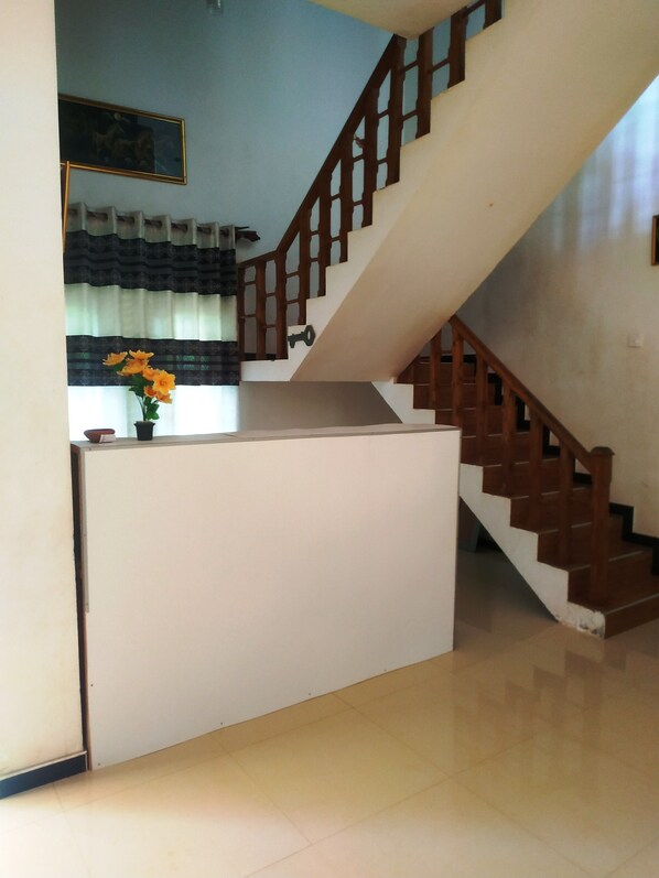 A staircase with wooden railings leading to an upper floor.