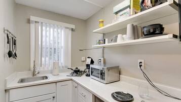 Fridge, microwave, stovetop, coffee/tea maker