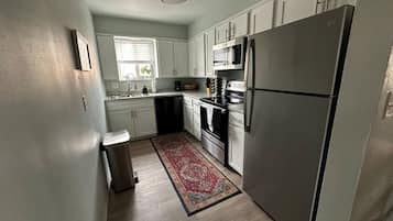 Fridge, coffee/tea maker, cookware/dishes/utensils