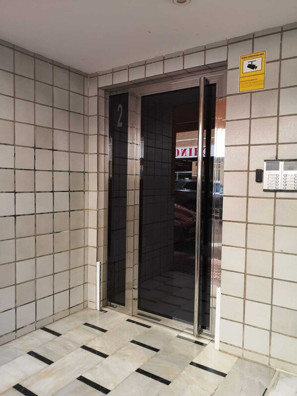 Access the second floor via this elevator, equipped with a convenient intercom system and video surveillance for added security.