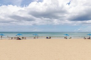 On the beach, sun-loungers, beach towels