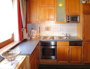 Appartement | Cuisine privée | Chaise haute