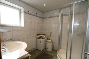 A bathroom with a sink, mirror, toilet, and shower. - Chalet in Fugen Near Spieljochbahn (Fuegen)
