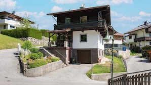 A two-story house with a balcony, a garage, and a pathway leading to the entrance. - Chalet in Fugen Near Spieljochbahn (Fuegen)
