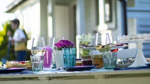 A dining table set outdoors with various dishes and drinks. - Large Holiday House With Terrace, Bobolin (Darlowo)