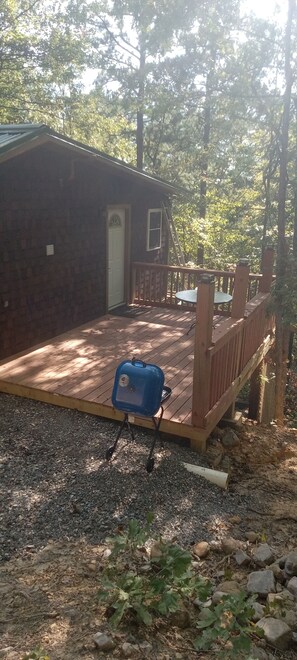 Terrace/patio - HICKORY HIDEOUT
The cabin is surrounded by a large area of trees for privacy (Mena)