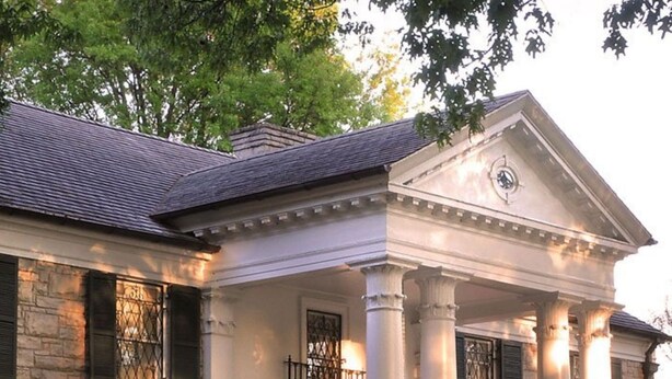 A stately house with a symmetrical facade, large columns, and a central entrance with a portico. - Memphis Retreat w/ Sunroom, Pool Table, Retro Gaming, Gym & Relaxing Vibe (Memphis)