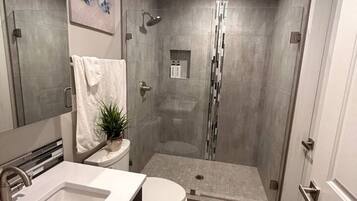 Shower, hair dryer, towels, soap