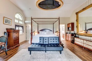 A bedroom with a four-poster bed, a large mirror, and a wooden dresser. - Mountain Views: Beautiful Nestlenook Farm Home! (Jackson)