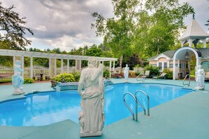 A swimming pool with statues, a gazebo, and a small pavilion. - Mountain Views: Beautiful Nestlenook Farm Home! (Jackson)