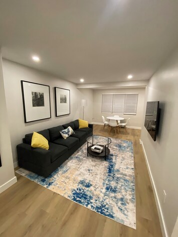 Living room with dining area that seats 4.