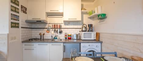 Fridge, microwave, coffee/tea maker, toaster