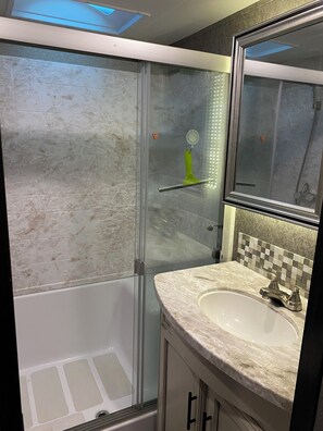 Shower, hair dryer, towels, soap