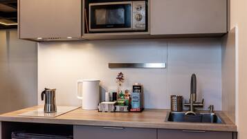 Fridge, microwave, stovetop, coffee/tea maker