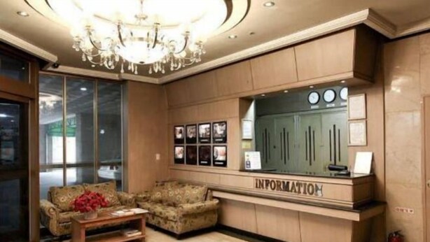 A reception area with a chandelier, a reception desk labeled "INFORMATION," and two sofas. - Hotel Cullinan Yongin (Yongin-si)