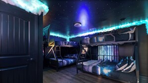 A room with bunk beds, a starry ceiling, and a door. - "Final Frontier"- Pool, Hot Tub, Pickleball, Basketball, Pond, Arcade, Putt Putt (Troutman)