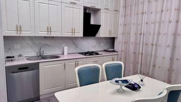 Fridge, dishwasher, dining tables