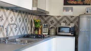 Apartment | Private kitchenette | Full-sized fridge, microwave, stovetop, dishwasher